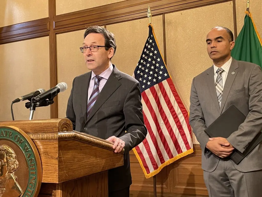 Washington Gov. Bob Ferguson discusses preparations that he and state Attorney General Nick Brown, right, are preparing if federal law enforcement agents conduct immigration activities similar to what’s occurred in Minnesota. Both are Democrats. (Photo by Jerry Cornfield/Washington State Standard)