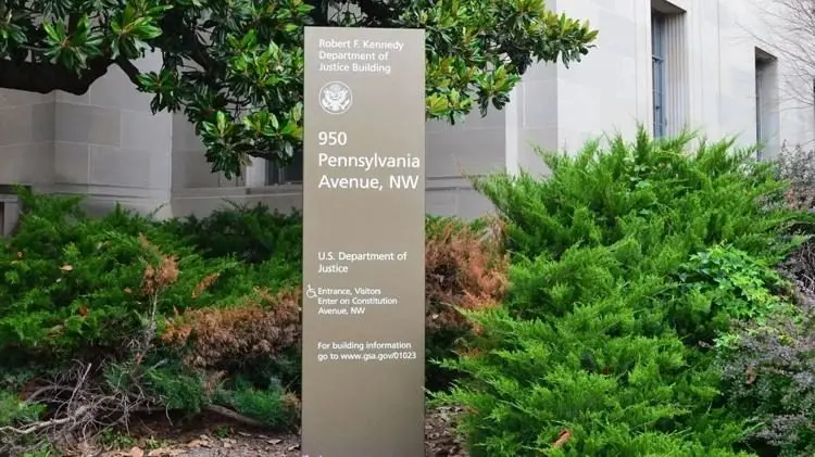 A sign stands outside the U.S. Department of Justice in Washington, D.C., June 22, 2025. Photo: Andrew Rice / The Center Square