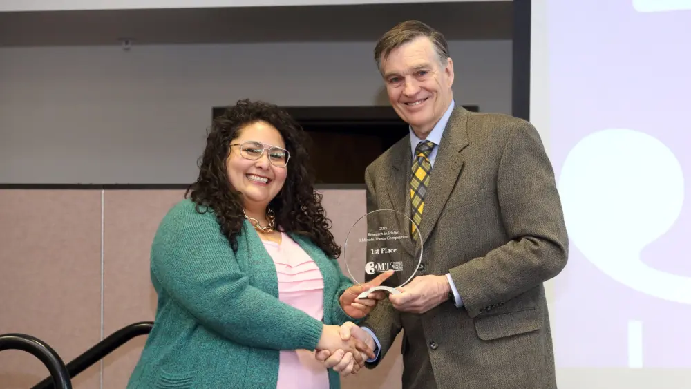 Rita Franco, left, stands with Jerry R. McMurtry, dean of the College of Graduate Studies, at the 2025 Idaho Statewide Three Minute Thesis competition. Franco won first place and the People’s Choice Award for her presentation, “Improving Child Nutrition Through Household Poultry Projects in Guatemala.” Photo courtesy: University of Idaho