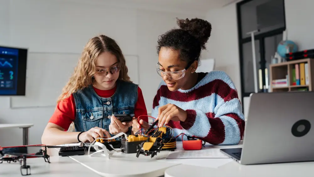 High school students working on robotics project. Girls in STEM. Photo courtesy of Sparklight