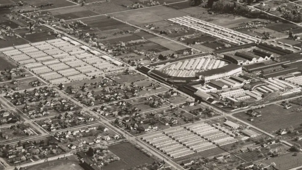 Aerial view of Camp Harmony at the Puyallup fairgrounds, April 14, 1942. Japanese Americans were temporarily detained at the site following Executive Order 9066. Photo: U.S. National Archives and Records Administration (Public Domain).