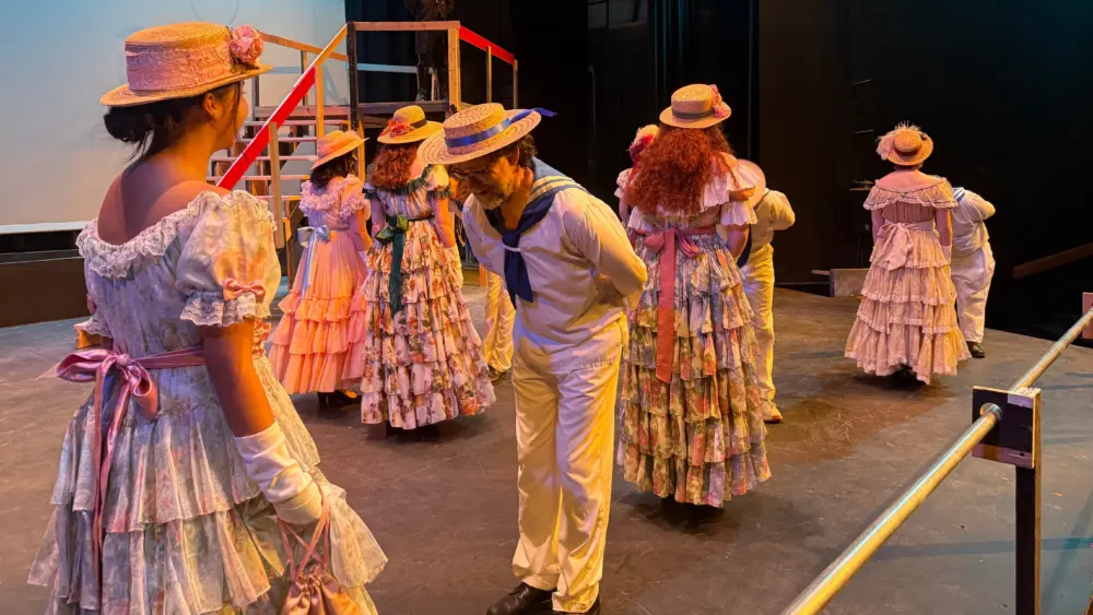 The cast of “H.M.S. Pinafore” rehearses in the Hartung Theater.
