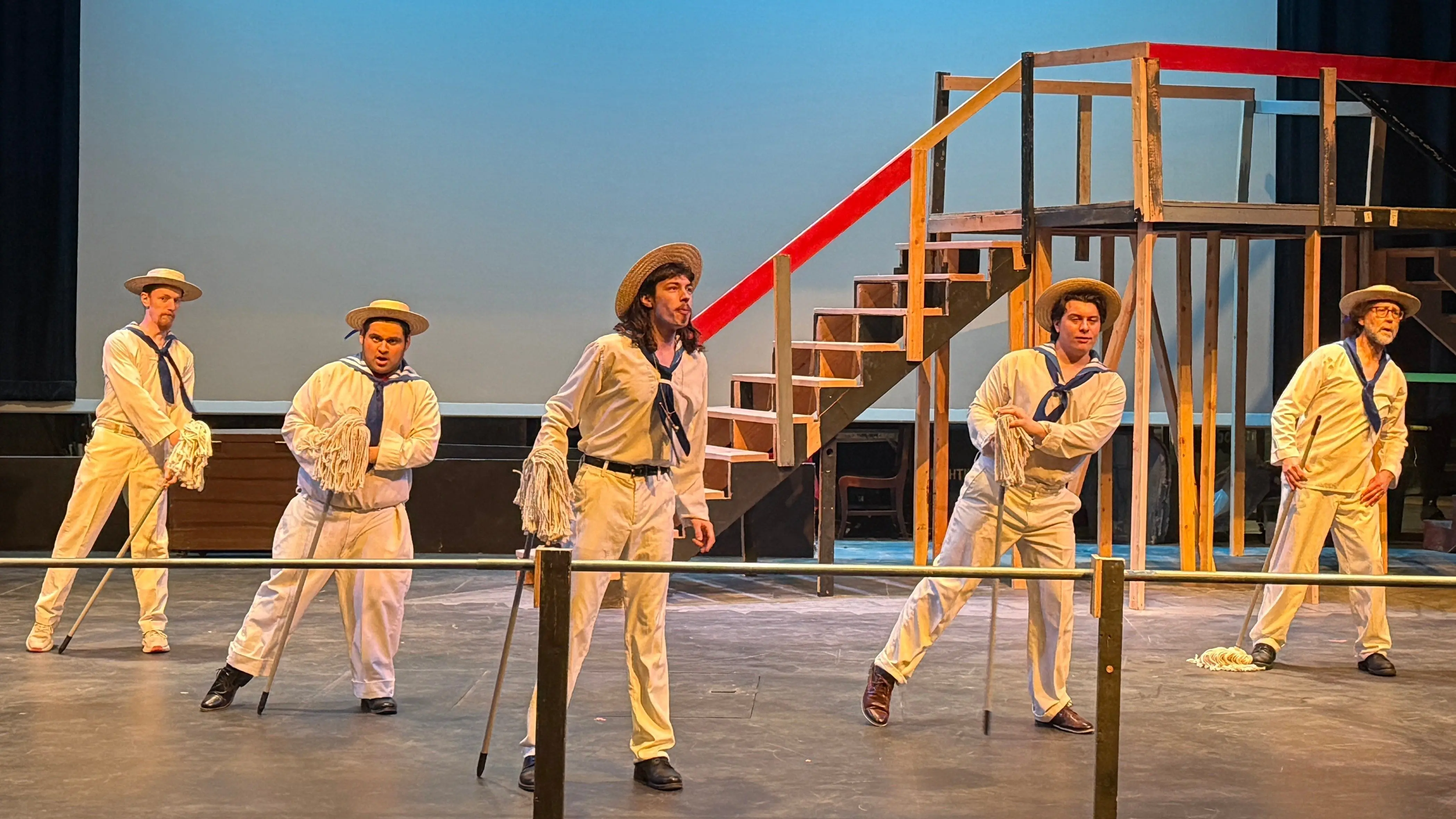 The cast of “H.M.S. Pinafore” rehearses in the Hartung Theater. - University of Idaho
