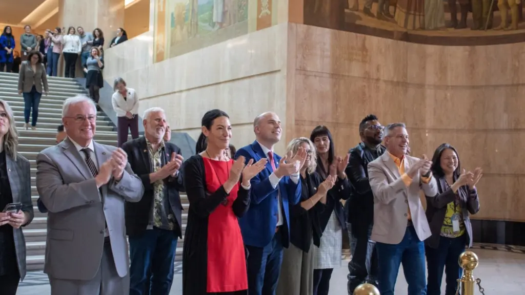 Oregon House members greet their colleagues from the Senate in a celebration of the end of the legislative session at the Capitol in Salem on Friday, March 6, 2026. (Photo by Mia Maldonado/Oregon Capital Chronicle)