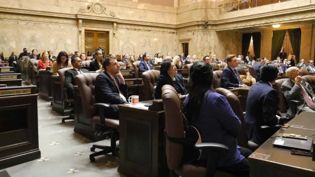 Democratic lawmakers watch as the roll is called on final passage of the income tax bill after nearly 25 hours of debate. (Photo by Bill Lucia/Washington State Standard.
