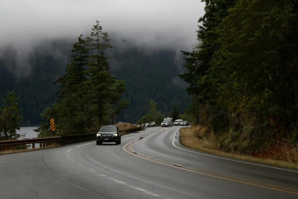 A foggy day on the U.S. 101 that runs along the perimeter of Lake Crescent in Olympic National Park. Photo by Zoshua Colah on Unsplash