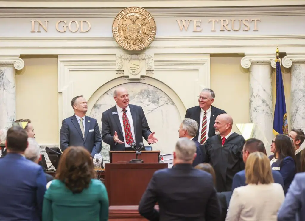 Idaho House Speaker Mike Moyle (behind lectern) speaks to Gov. Brad Little after the governor finished his State of the State Address on Jan. 12, 2026, at the State Capitol Building in Boise. (Photo by Pat Sutphin for the Idaho Capital Sun)