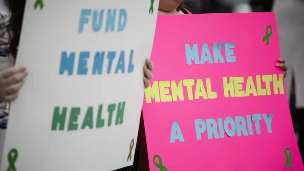 People rally for mental health care funding at the Pennsylvania Capitol in 2022. Federal Medicaid cuts could threaten already-struggling psychiatric units at hospitals across the country. (Photo by Amanda Berg for Pennsylvania Capital-Star)