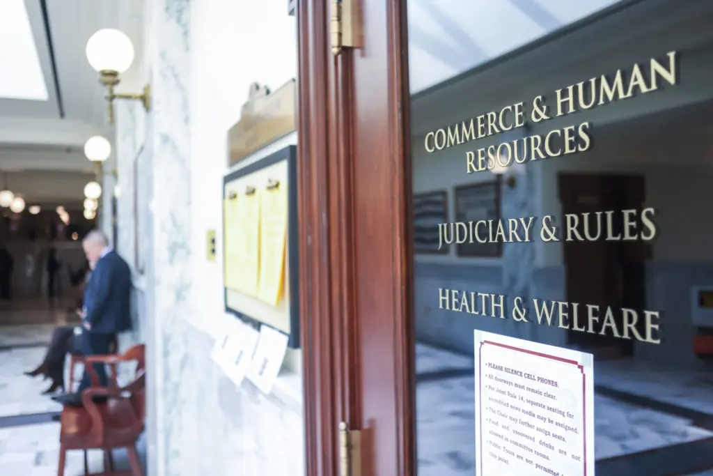 The entrance to the hearing room for the Idaho Senate’s Commerce and Human Resources, Judiciary and Rules, and Health and Welfare committees as seen on March 16, 2026, at the Idaho State Capitol Building in Boise. (Photo by Pat Sutphin for the Idaho Capital Sun)