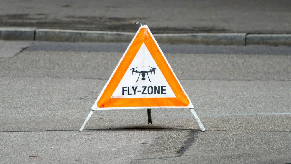 File photo: A warning sign indicating a restricted drone fly zone. (Unsplash / Valentin Zickner)