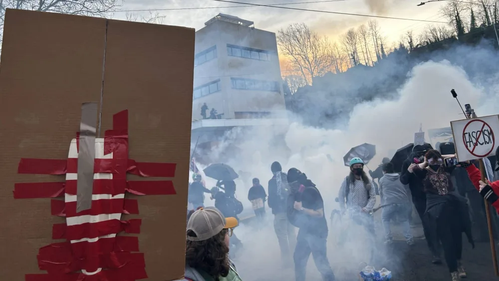 Members of 30 Oregon labor unions organized a march against U.S. Immigration and Customs Enforcement near an ICE facility in Portland on Jan. 31, 2026. The march ended at the facility, where federal officers shot tear gas, pepper balls and rubber bullets at the crowd, which included children. (Photo by Alex Baumhardt/Oregon Capital Chronicle)