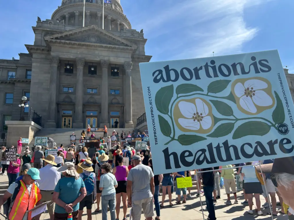 A few hundred people attended a rally in front of the Idaho State Capitol on Saturday to support the start of signature gathering for an abortion rights ballot initiative. (Photo by Kyle Pfannenstiel/Idaho Capital Sun)