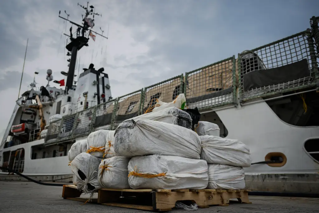 The crew of the Coast Guard cutter Vigorous offloads about 840 pounds of cocaine at Base Miami Beach, Fla., on June 5, 2025. Photo: Petty Officer 3rd Class Jessica Walker / U.S. Coast Guard via DVIDS / Public Domain