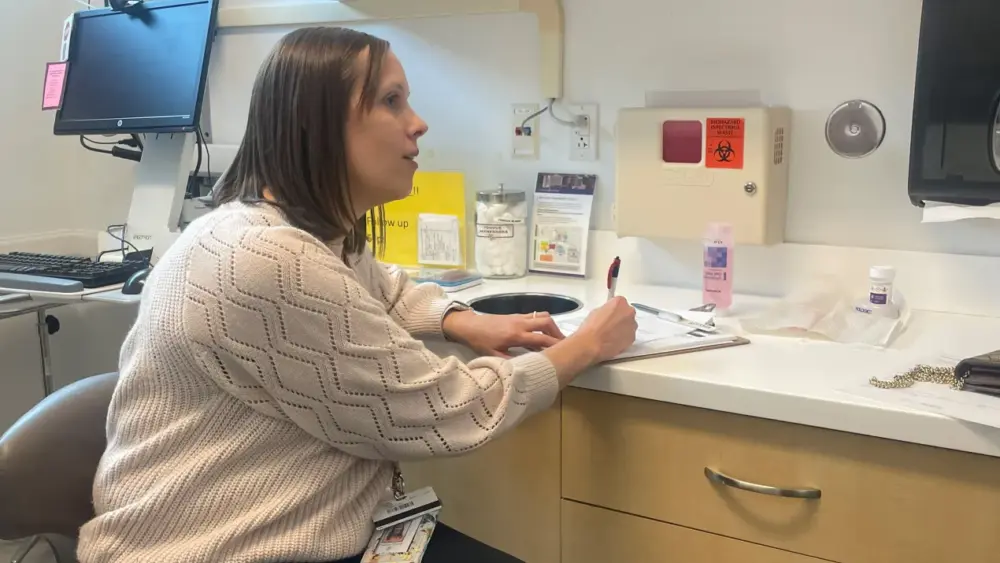 Jessica Norton is an OB-GYN who treats many patients with Medicaid coverage at an Affinia Healthcare clinic in St. Louis. She worries many of her patients are at risk of losing their health coverage under new Medicaid work requirements because they’re caring for their parents or other family members full-time. (Samantha Liss/KFF Health News)