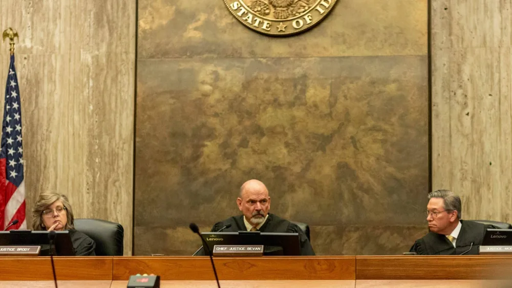Idaho Supreme Court justices listen to oral arguments in an abortion rights ballot initiative lawsuit on Friday, April 25, 2025. From left to right: Justice Robyn Brody, Chief Justice G. Richard Bevan, and Justice Gregory Moeller. (Kyle Pfannenstiel/Idaho Capital Sun)