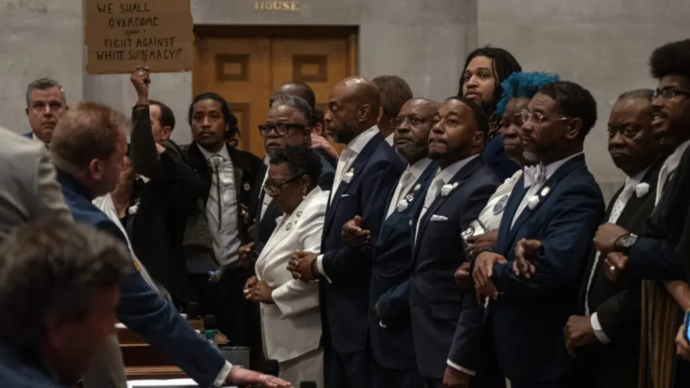 Tennessee Democrats lock arms on the Tennessee House floor in protest of a Republican redistricting vote that split up a majority-Black, majority-Democratic congressional district. Tennessee is one of several states redrawing its congressional maps in the aftermath of a recent US Supreme Court decision. (Photo by John Partipilo/Tennessee Lookout)