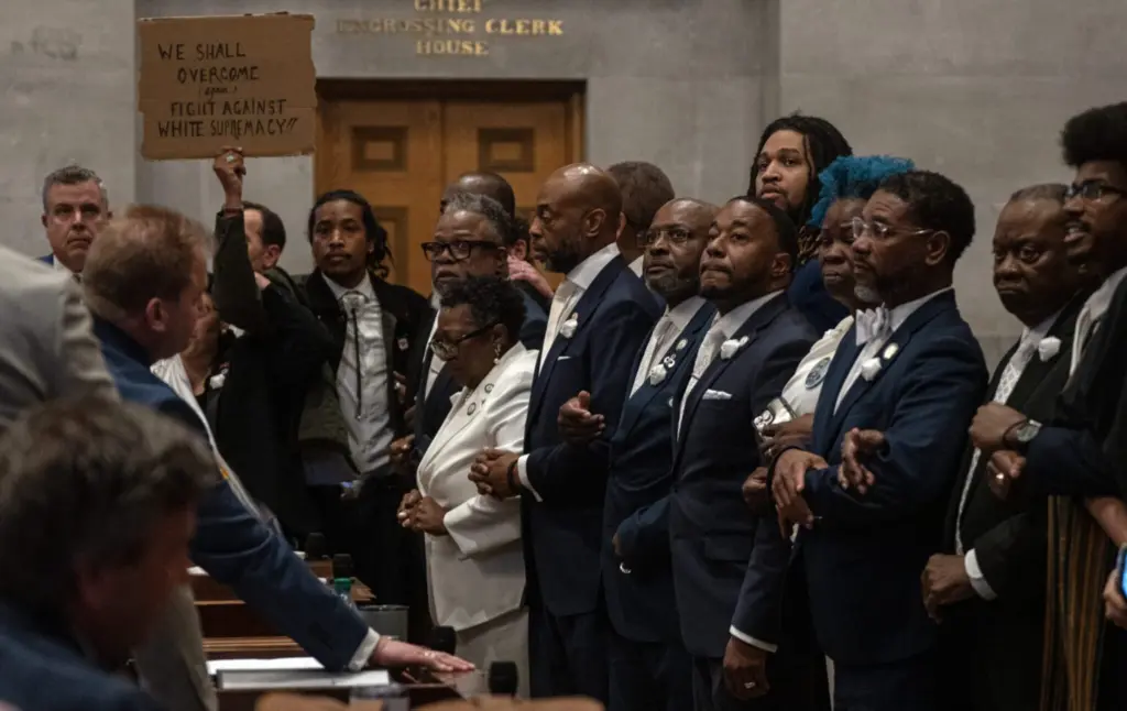 Tennessee Democrats lock arms on the Tennessee House floor in protest of a Republican redistricting vote that split up a majority-Black, majority-Democratic congressional district. Tennessee is one of several states redrawing its congressional maps in the aftermath of a recent US Supreme Court decision. (Photo by John Partipilo/Tennessee Lookout)