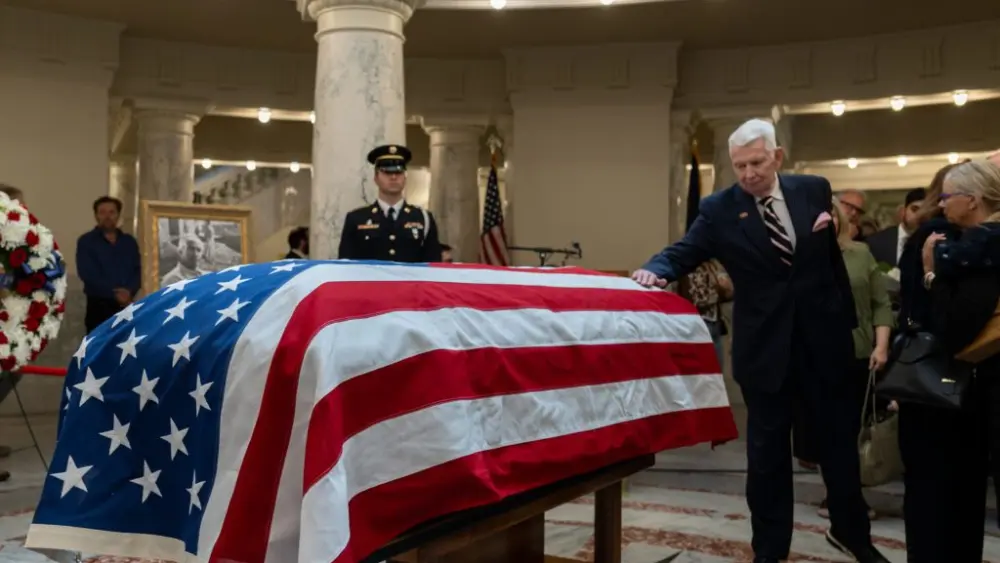 Former Idaho Attorney General David Leroy pays his respects as former Idaho Gov. Dirk Kempthorne lies in state in the Idaho State Capitol on Friday, May 15, 2026. (Photo by Kyle Pfannenstiel/Idaho Capital Sun)