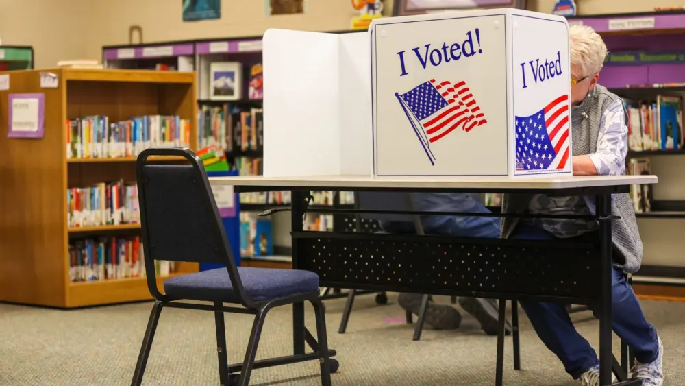 A voter casts her ballot during the May 19, 2026, primary election at Westside Elementary School in Idaho Falls. (Photo by Pat Sutphin for the Idaho Capital Sun)