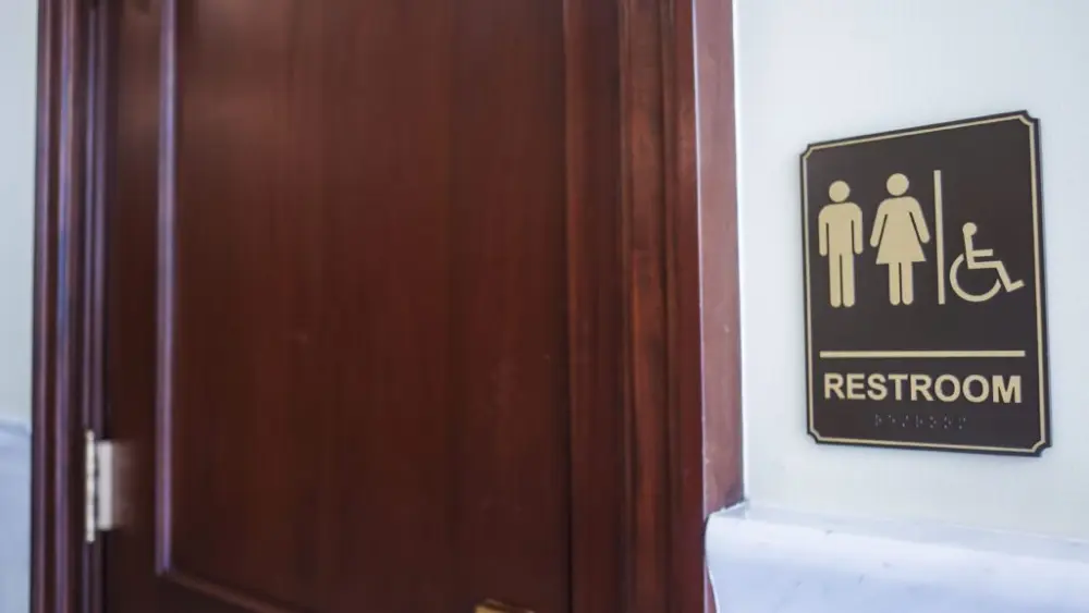 A bathroom sign as seen on March 16, 2026, at the State Capitol Building in Boise. (Photo by Pat Sutphin for the Idaho Capital Sun)