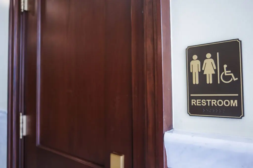 A bathroom sign as seen on March 16, 2026, at the State Capitol Building in Boise. (Photo by Pat Sutphin for the Idaho Capital Sun)