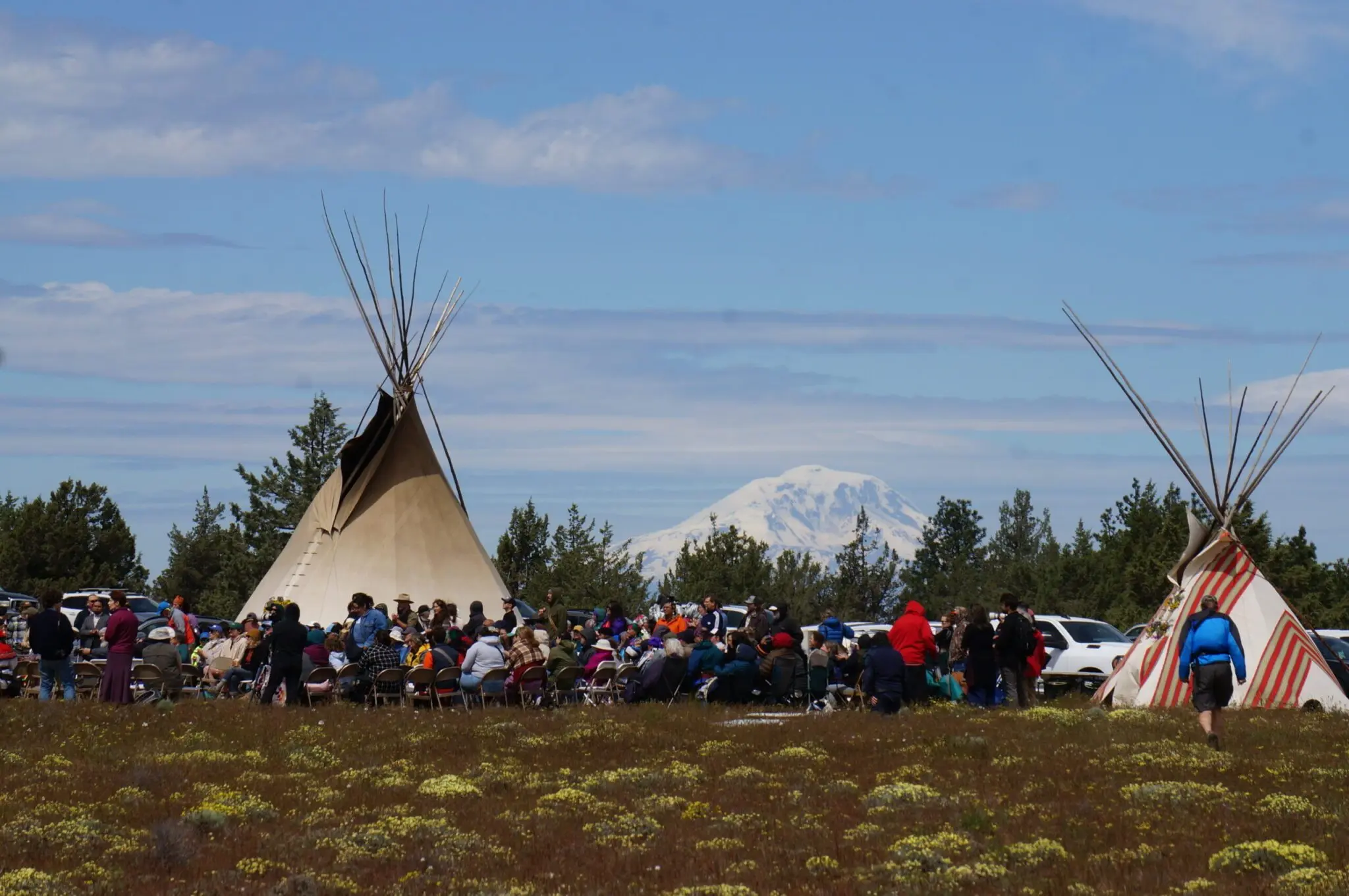 People gather near Pushpum, a site sacred to Columbia River tribes near Goldendale, Wash. on Friday, May 8, 2026. Leaders from the Yakama Nation, as well as nonprofit environmental groups, are hoping to stop the development of a pumped storage energy project which they say will threaten the site, the seeds and roots tribal members harvest from it as well as wetlands, groundwater and wildlife in the area. (Photo by Alex Baumhardt/Oregon Capital Chronicle)