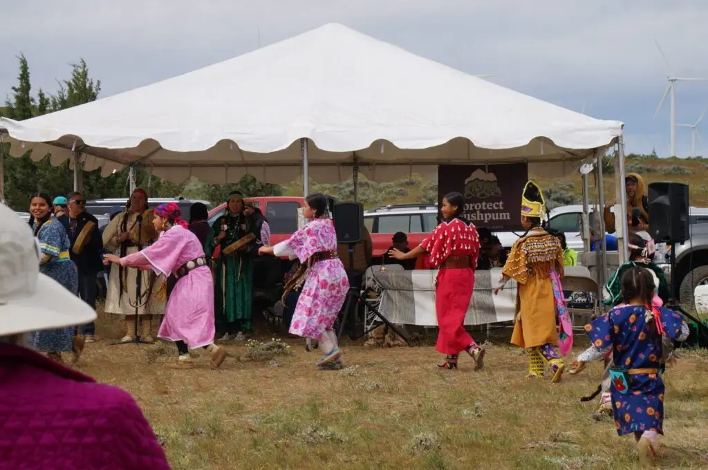 Youth from the Yakama Nation perform the Swan Dance near Pushpum, a site sacred to Columbia River tribes near Goldendale, Wash. on Friday, May 8, 2026. (Photo by Alex Baumhardt/Oregon Capital Chronicle)