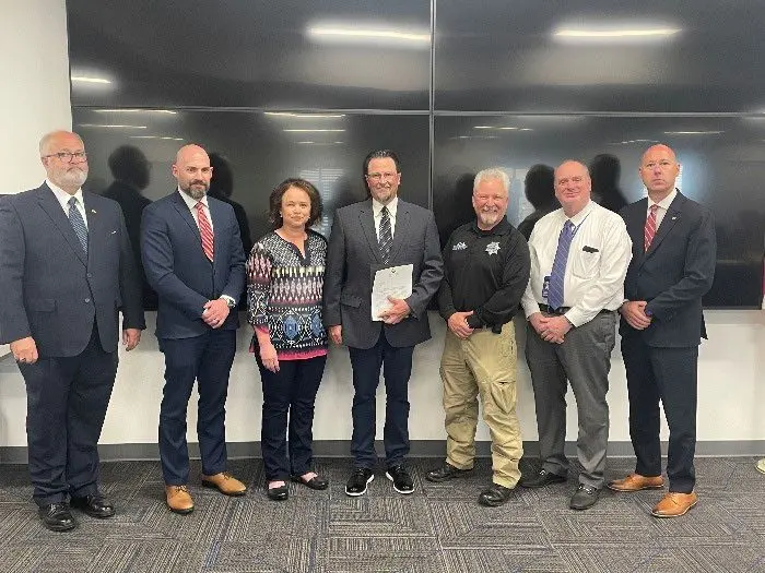 Photo caption: Detective Korey Payne receives Idaho's Hometown Hero Award from the U.S. Attorney's Office for his work investigating child exploitation cases. Photo courtesy of the United States Attorney's Office for the District of Idaho.
