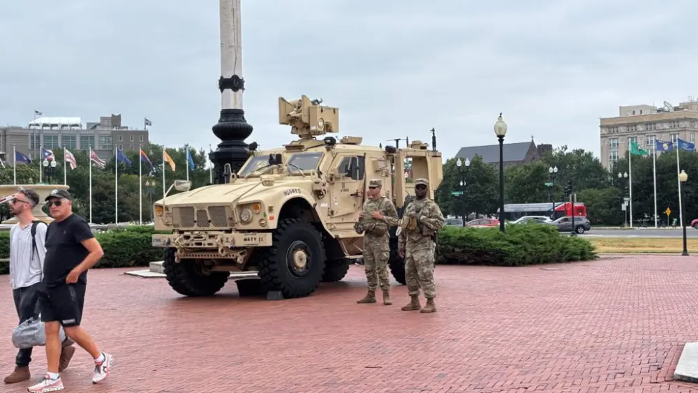 A federal judge on June 5, 2026, struck down several Trump administration policies that halted processing for asylum-seekers following a shooting in Washington, D.C. of two members of the National Guard deployed to the nation’s capital. In this photo, tourists pass by members of the guard stationed outside Union Station in Washington, D.C., on Aug. 18, 2025. (Photo by Jane Norman/States Newsroom)