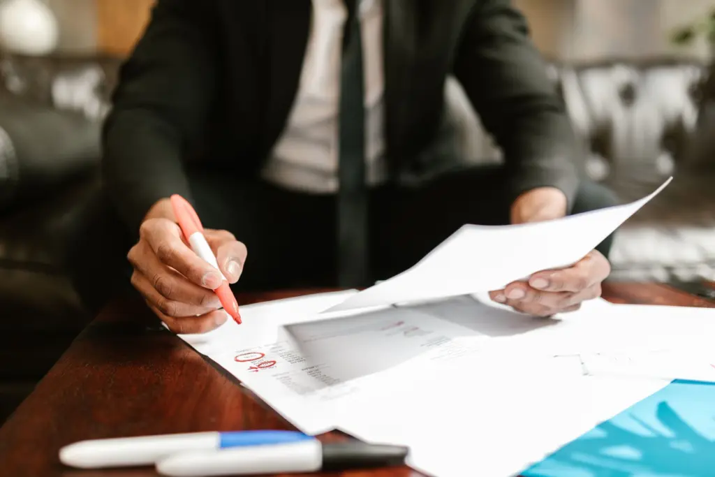 Photo by RDNE Stock project: https://www.pexels.com/photo/man-working-with-documents-on-table-7821541/