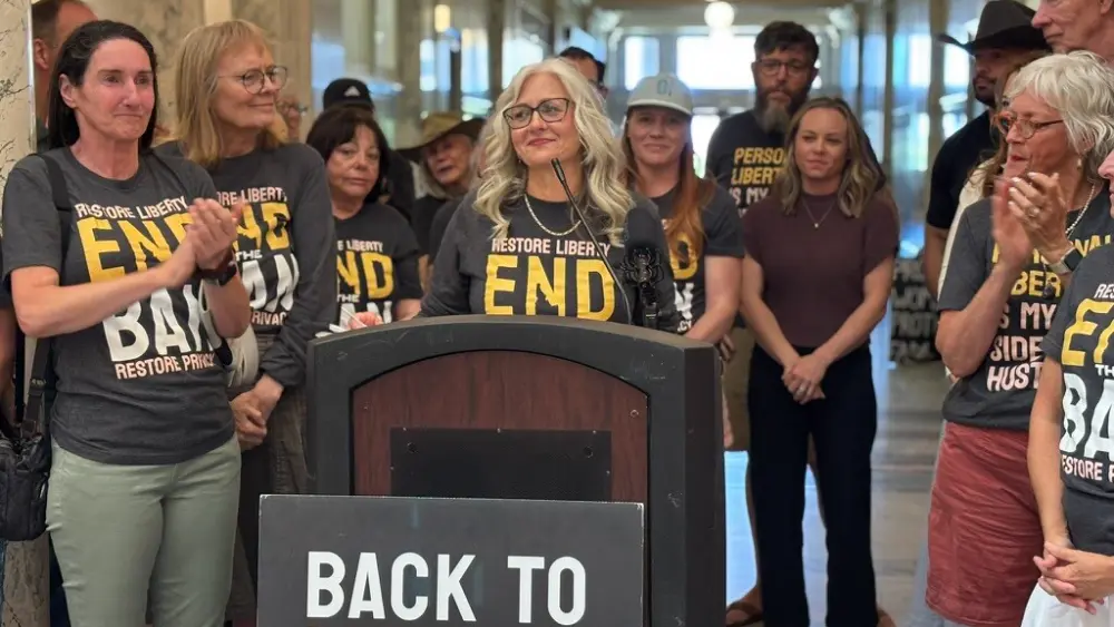 Volunteer organizer Suzanne Gallus speaks to fellow volunteers and supporters at an event at the Idaho Capitol on July 2. (Photo by Kelcie Moseley-Morris/Stateline)