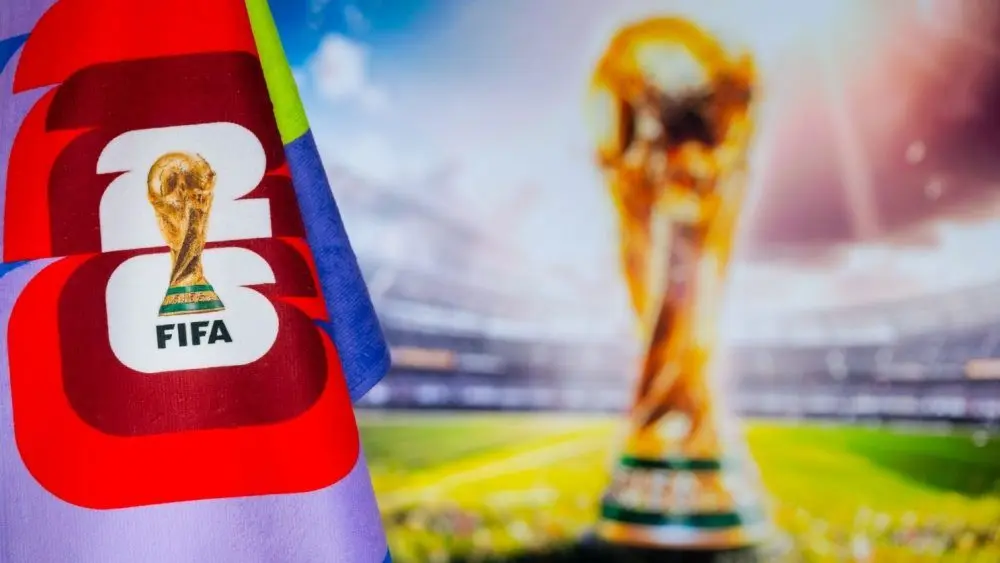 FIFA World Cup in 2026 background^ official logo of World cup in United States^ Mexico and Canada and colorful blurred background with gold trophy.