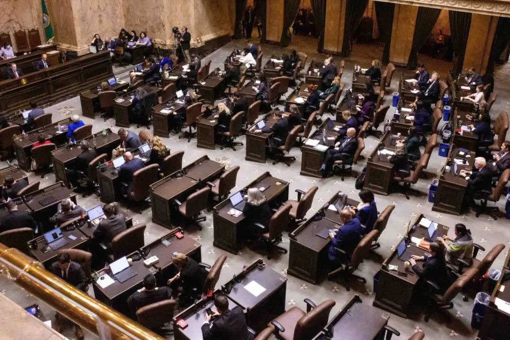 Washington state lawmakers in the House chamber on the first day of the 2026 legislative session. With several incumbent House Republicans trailing in the Aug. 4 primary, Democrats are positioned to add to their majority in the chamber for 2027. (Photo by Jacquelyn Jimenez Romero/Washington State Standard)