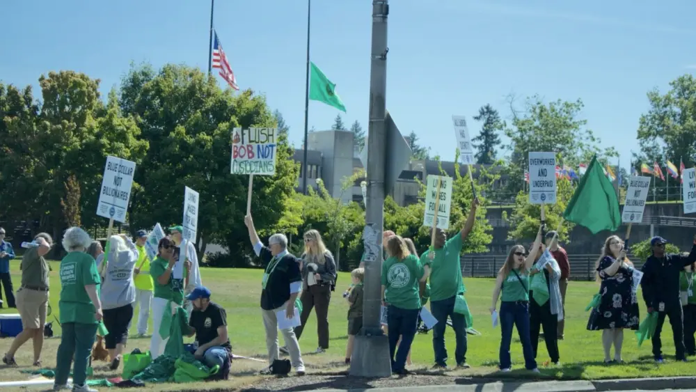 Roughly 100 state employees, most of whom are members of the Washington Federation of State Employees, lined Capitol Way in Olympia, Wash. on Aug. 31, 2026 to demand higher wages in their next two-year contract. (Photo by Aspen Ford/Washington State Standard)