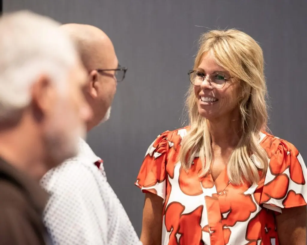 Idaho State Superintendent of Public Instruction Debbie Critchfield, a Republican running for another term in November, speaks to an attendee after a candidate forum on Aug. 4, 2026, in Boise. (Photo by Sean Dolan/EdNews)
