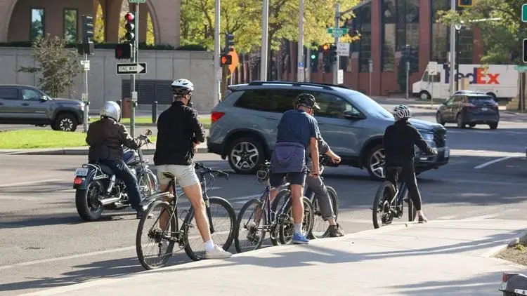Cyclists wait at an intersection in Spokane, Wash. Photo: Tim Clouser / The Center Square