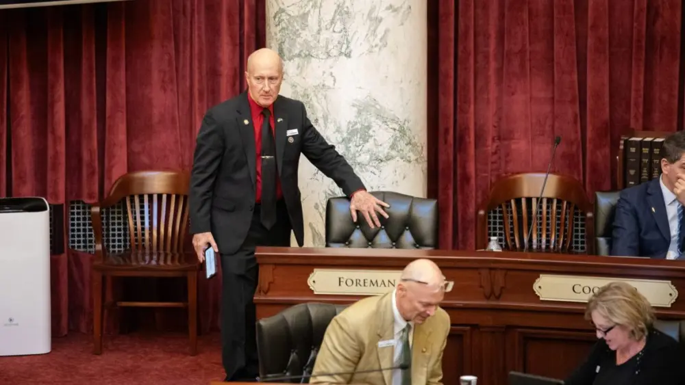 Sen. Dan Foreman, R-Moscow, walks to his seat on the Senate floor on Thursday, April 2, 2026. Foreman defeated the more moderate Lori McCann in the May primary. Voters in District 6 will decide in November between Foreman and Democrat Robin Weldy. (Sean Dolan/EdNews)