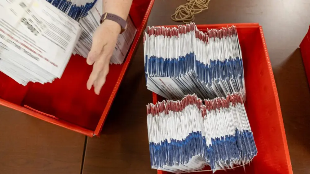 Ada County election workers sort hundreds of absentee ballots for the 2026 general election on Oct. 1, 2026. (Photo by Kyle Pfannenstiel/Idaho Capital Sun)