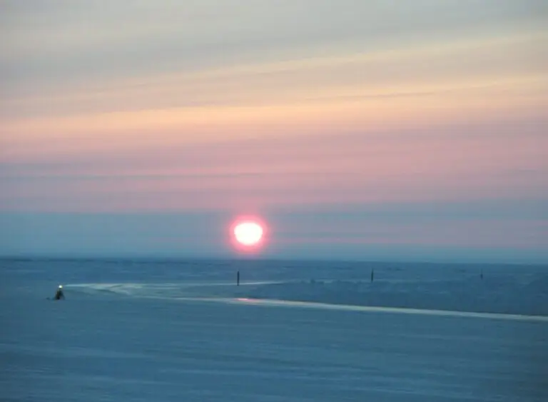 Light from the setting sun on March 21, 2008 is reflected on the surface of an ice road in the National Petroleum Reserve in Alaska. Under a new Trump administration rule, new ice roads and other oil-exploration projects in the reserve will no longer have to undergo case-by-case environmental analysis. (Photo by Wayne Svejnoha/U.S. Bureau of Land Management)