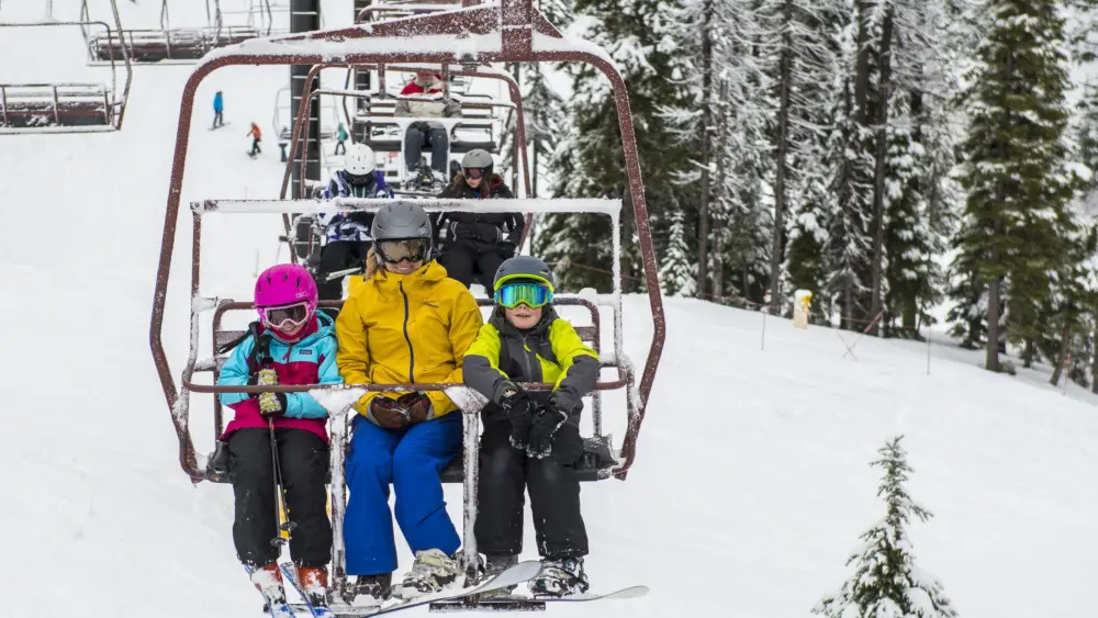 KELLOGG, Idaho (Feb. 18, 2017) — Youths Hazel and Hollatz Hudson (left and right, respectively) and their mom Nikki (center) enjoy a day skiing and snowboarding Silver Mountain Resort in North Idaho. (Photo courtesy of Colin Meagher)