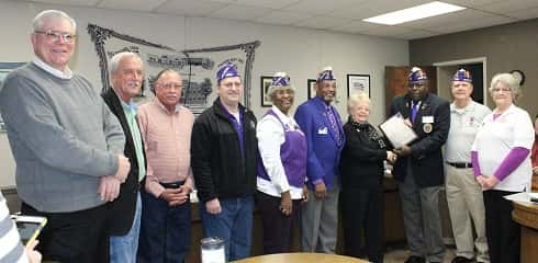 Benjamin L. Cooper, Department Commander for the Kentucky Military Order of the Purple Heart presented Judge Chyrill Miller and the Fiscal Court with a plaque commemorating the county as a Purple Heart County.