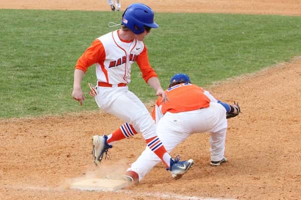 Chase Bright trying to out-run the throw to first in the Marshals 16-6 win over Clayton.