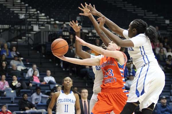 Michaela Manley was covered up by the Tilghman defense in this attempt and led the Lady Marshals with 14 points.