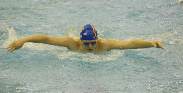 Coleton Jones, swimming the 100 yard butterfly event, placing 21st in Friday's preliminaries. Photo by Kent Hall.