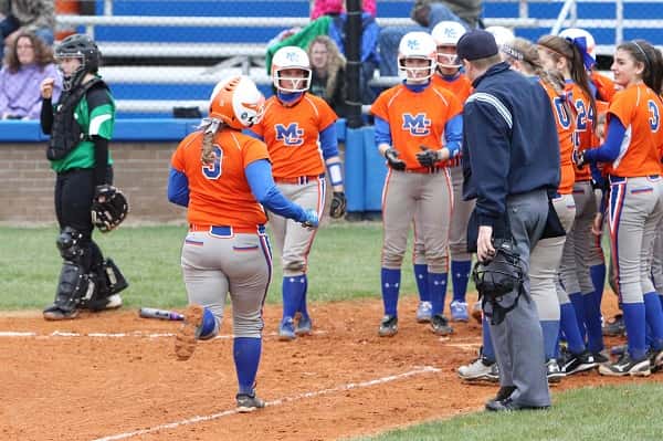 Abby Fiessinger was greeted at home plate by the Lady Marshals following her grand slam against Ballard Memorial Friday.