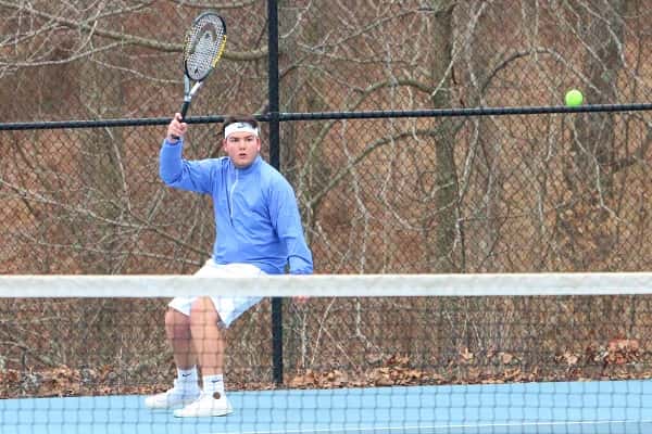 Senior Sam Gold, winning his match here against CCA's James Luke McGee, is one of the veteran players returning for the boy's tennis team.