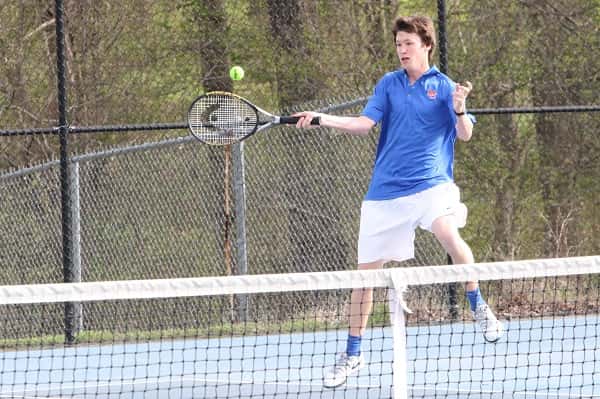 Conner Jones with a return against Calloway in doubles play.