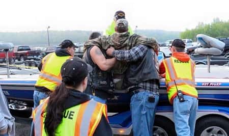Squad members assist fishermen with loading/unloading