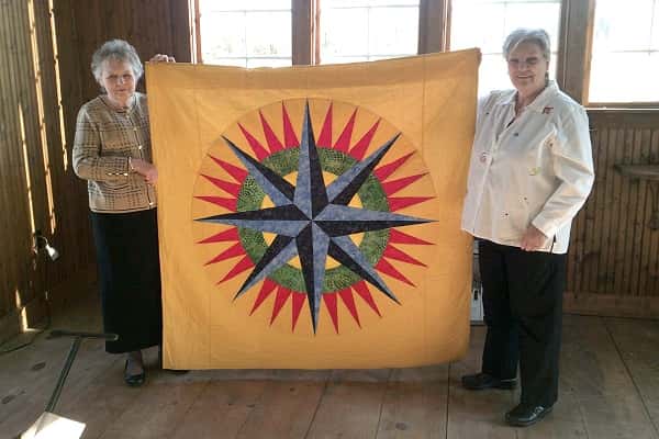 Clarks River Chapter DAR member Lelia Madge Reising showcases her quilt entitled "A Mariner’s Compass".