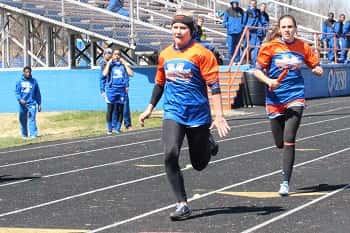 Sydney Goff, handing off to Kara Kelley earlier this season, were both a big part of the relay events at Friday's Twilight Relays.